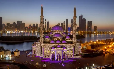 Al Noor Mosque glowing by Sharjah waterfront